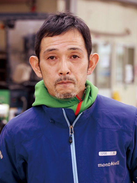 三 角 哲 男